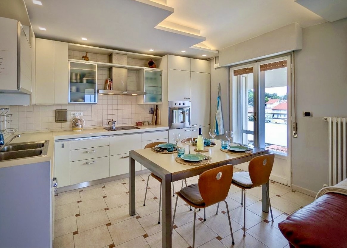 Open-plan kitchen with dining table for family meals